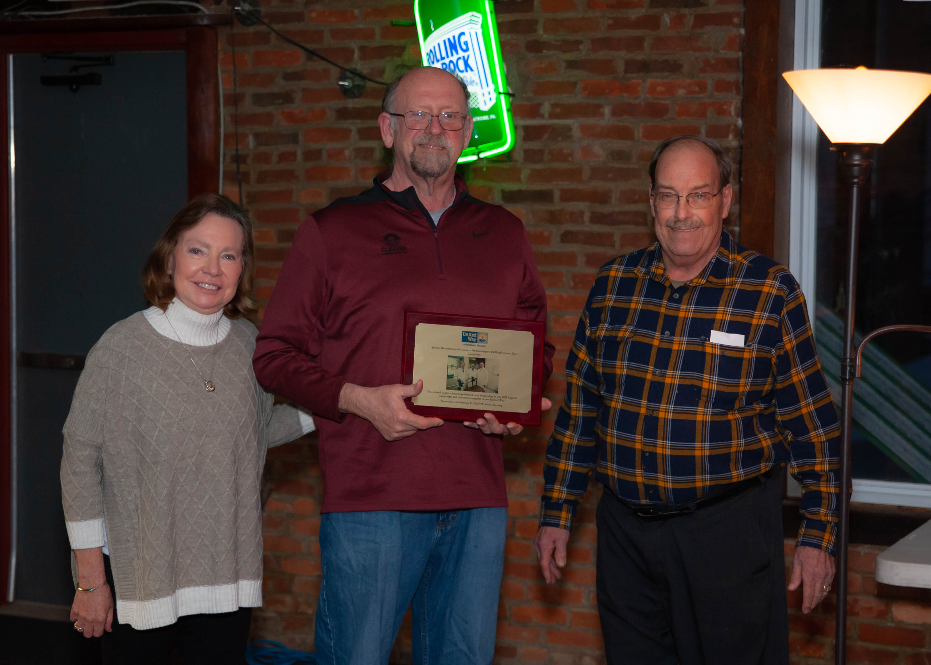 Dr. Lloyd and Kathy Cleaver of Cleaver Dermatology accepting award for Cleaver Dermatology's $5000 donation to the 2021 Campaign